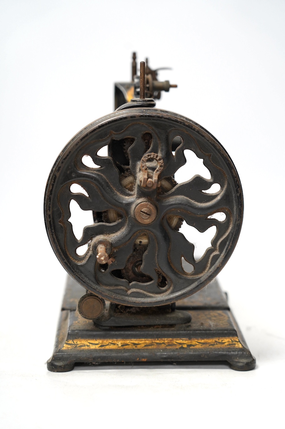 An 1870's Edward Ward sewing machine and a cast iron base with gilt decoration and maker’s marks. Condition - fair